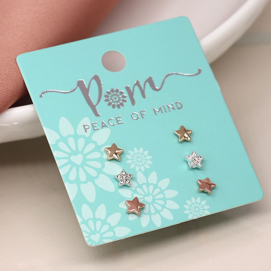 Set of three gold and silver star stud earrings from POM Jewellery by Cornucopia Home and Gift, featuring shiny star designs.
