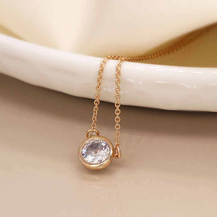 Gold plated crystal necklace from POM Jewellery by Cornucopia Home and Gift, featuring a delicate chain with sparkling crystal accents.