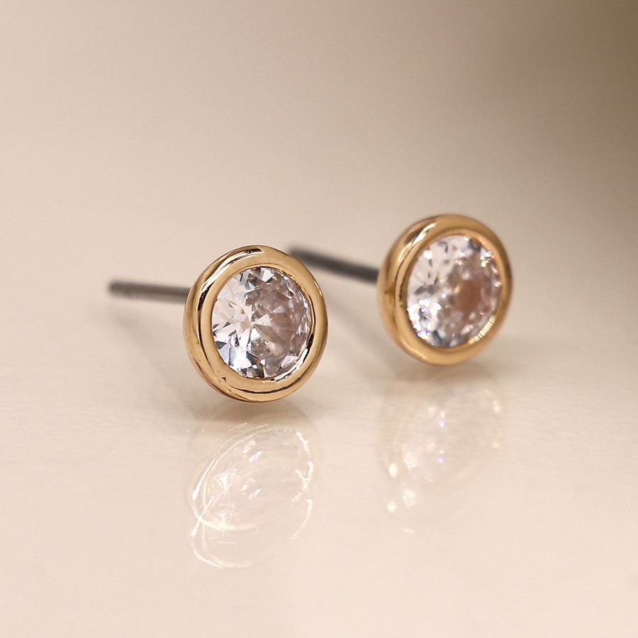 Golden round stud earrings with crystal accents from POM Jewellery by Cornucopia Home and Gift, featuring a polished gold-plated finish.