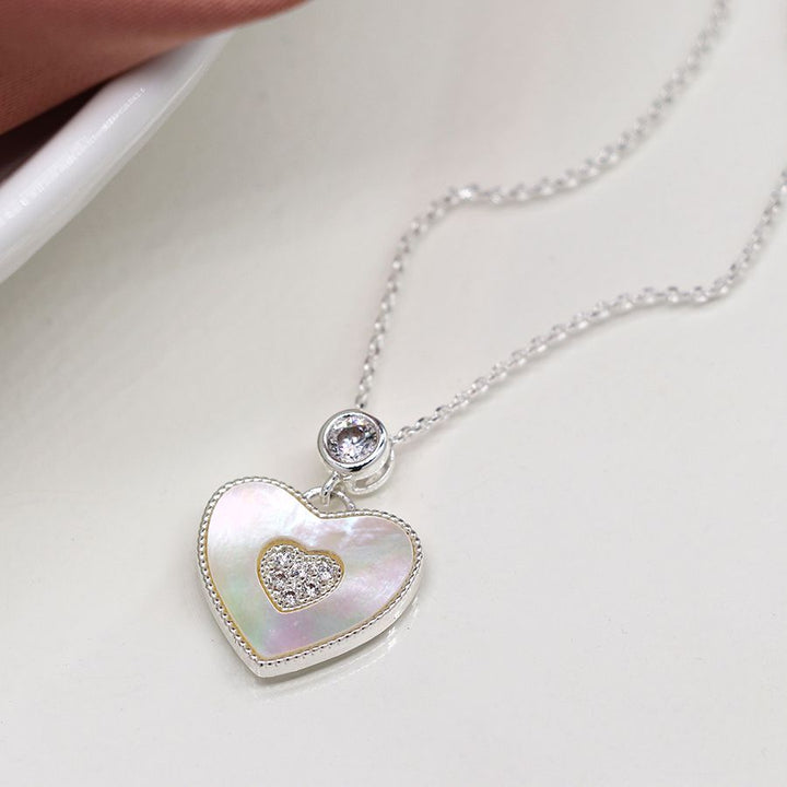 Heart-shaped necklace by POM Jewellery from Cornucopia Home and Gift, featuring a delicate chain and polished heart pendant.