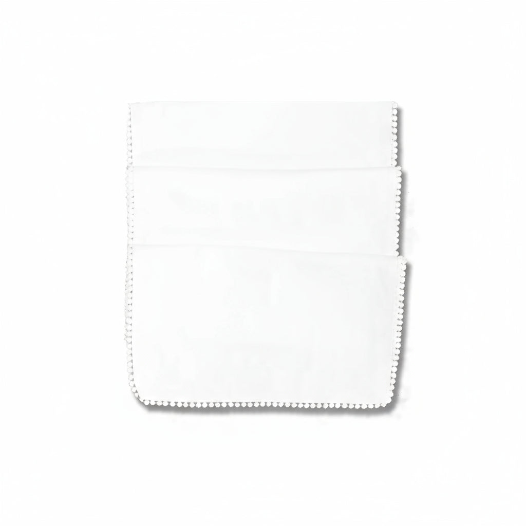 Pearl white table runner with French knot detailing by Cornucopia Home and Gift, perfect for elegant table decor.