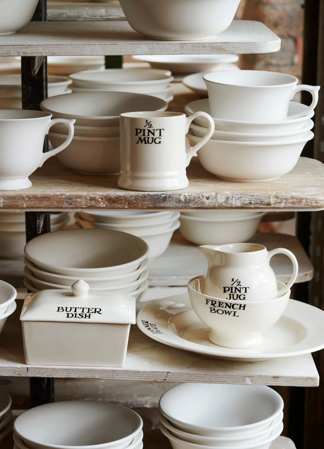 Emma Bridgewater Black Toast ½ Pint Mug with black toast pattern, ceramic material, and classic mug shape.