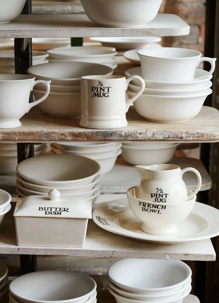 Emma Bridgewater Black Toast ½ Pint Mug with black toast pattern, ceramic material, and classic mug shape.