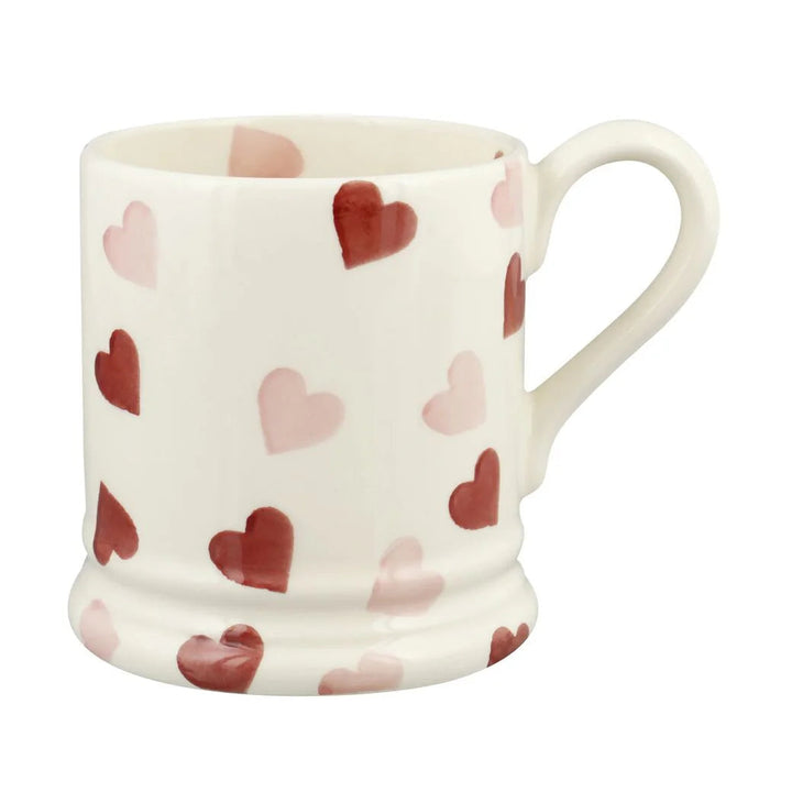 Emma Bridgewater pink hearts 1/2 pint mug with a cheerful heart pattern and a pink interior, perfect for enjoying beverages.