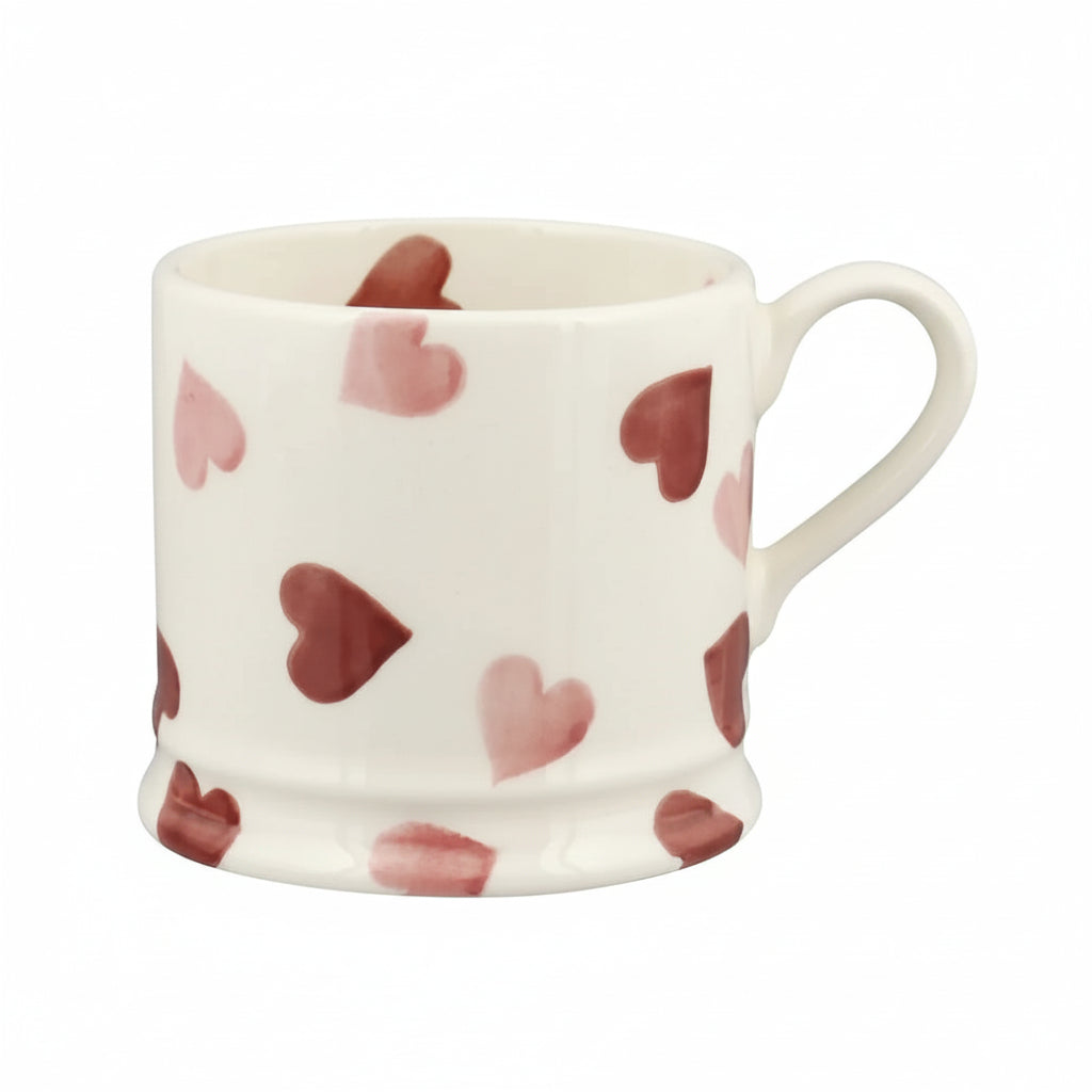 White mug with red heart pattern on a white background
