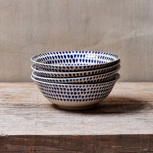 Indigo Drop cereal bowl by Nkuku featuring a vibrant blue and white ceramic design, perfect for breakfast or serving snacks.