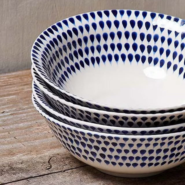 Nkuku Indigo Drop Cereal Bowl with blue and white glaze, round ceramic design suitable for breakfast or serving snacks.