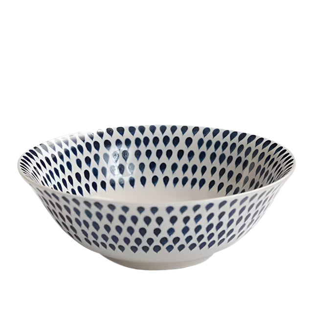 Indigo Drop cereal bowl by Nkuku featuring a glazed ceramic design with a rounded shape and vibrant blue drop pattern.
