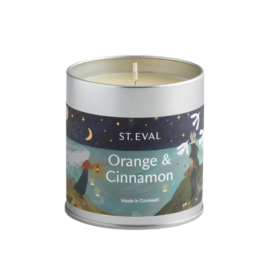St Eval Christmas orange and cinnamon tin candle with festive orange and cinnamon scent in a decorative tin container.
