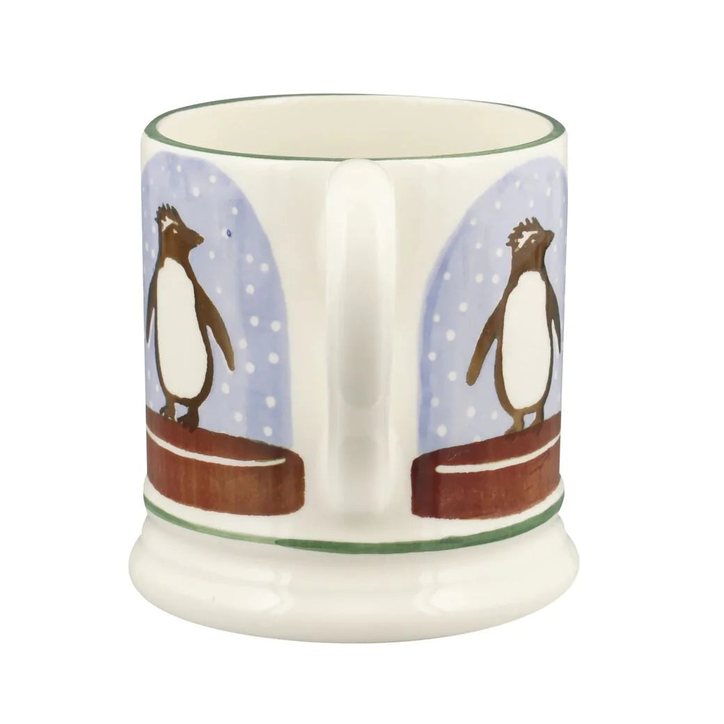 Emma Bridgewater Penguin Snow Globe Half Pint Mug with festive snow globe design and penguin illustration, holiday-themed ceramic mug.