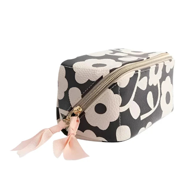 Caroline Gardner Mono Flower makeup organiser with compartments for cosmetics, featuring a floral design and compact storage.