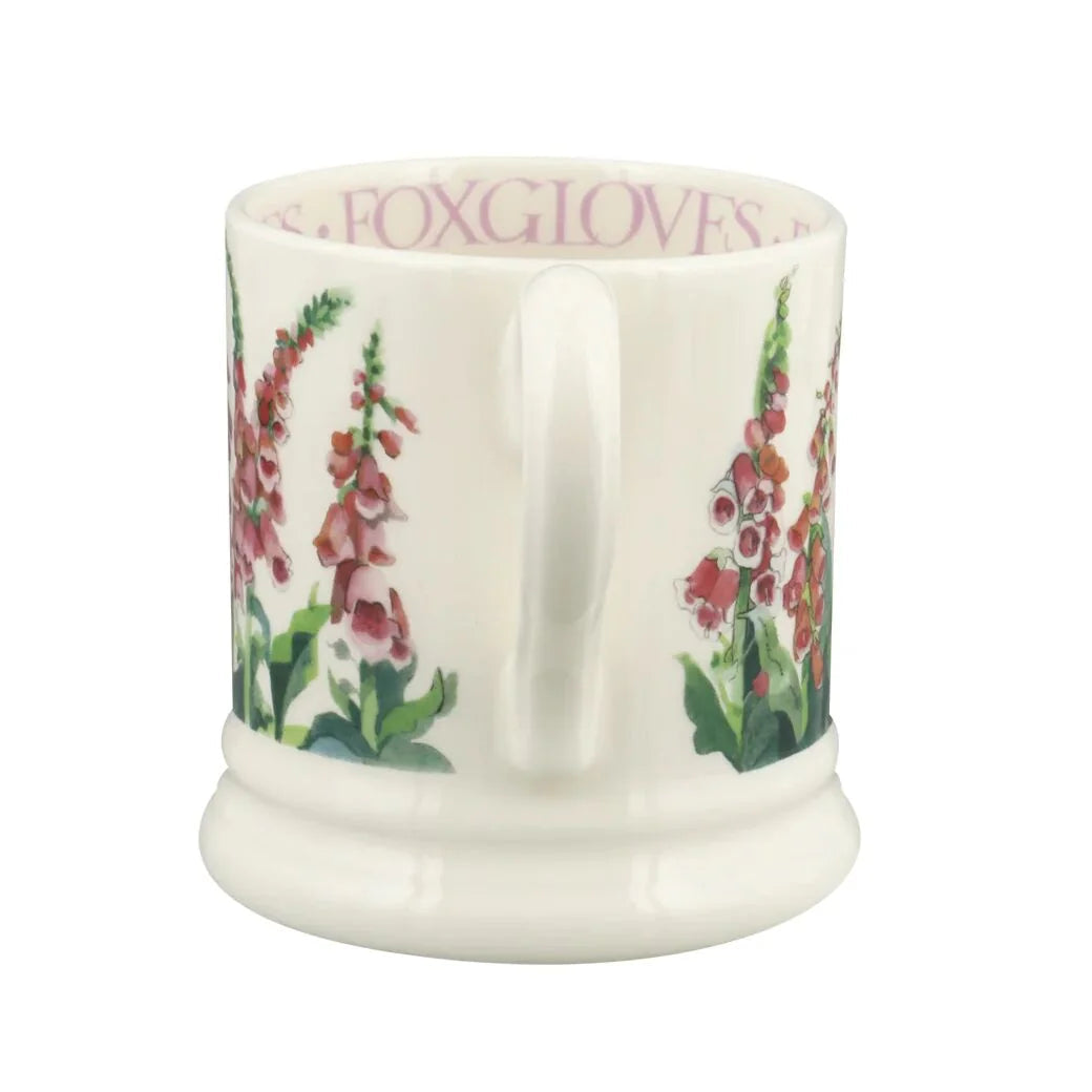 White ceramic mug with floral design and &