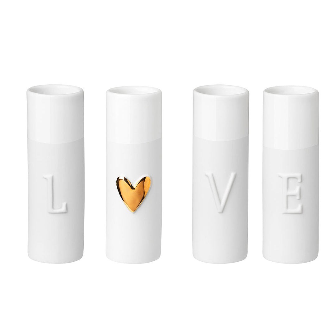 Set of four Radër Love Mini Vases by Cornucopia Home and Gift, featuring small decorative glass vases for floral arrangements.
