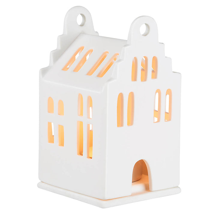 Small porcelain lighthouse model by Radër featuring a gabled roof and detailed design, perfect for home decor or display.