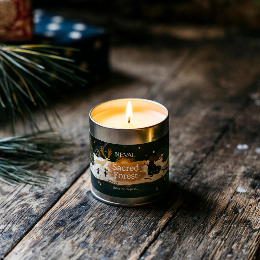 St Eval Sacred Forest scented tin candle by Cornucopia Home and Gift, featuring a festive forest design on a small metal candle tin.