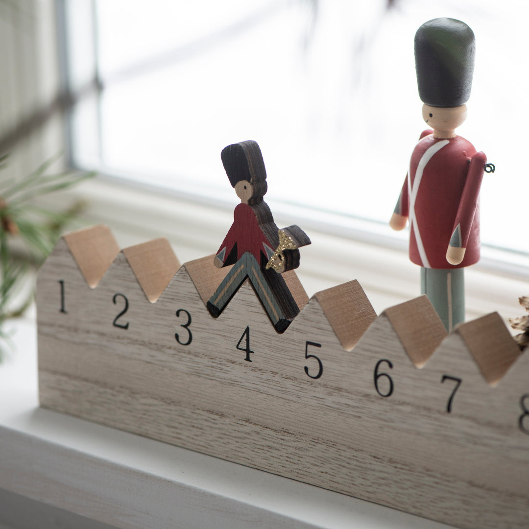 IB Laursen Christmas Walking Guard Advent Calendar by Cornucopia Home and Gift, featuring colorful holiday-themed figures.