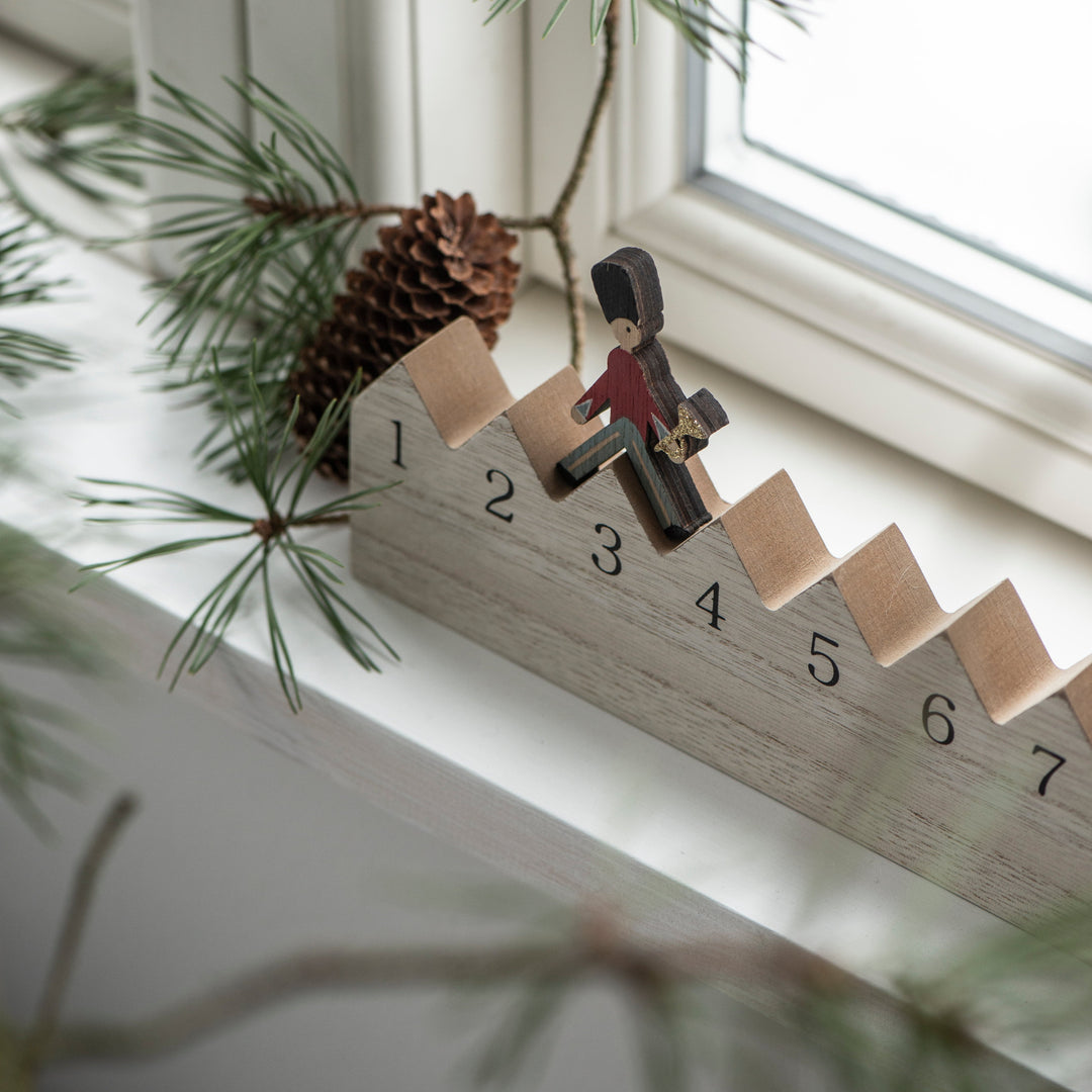 IB Laursen Christmas Walking Guard Advent Calendar by Cornucopia Home and Gift, featuring festive holiday design with 24 numbered doors.