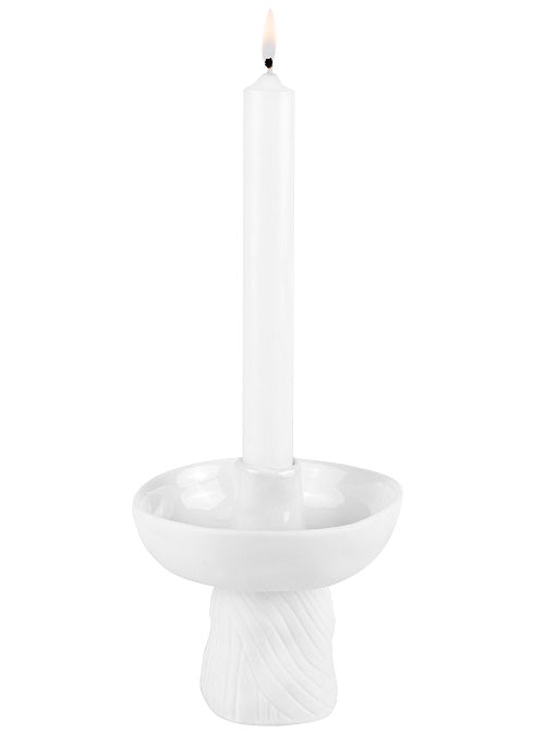 White candle holder with a candle on a white background