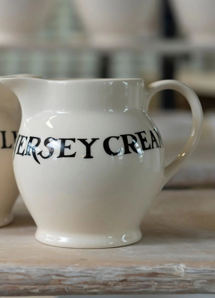 Emma Bridgewater Black Toast Jersey Cream ½ pint ceramic jug with black toast pattern, perfect for kitchen decor or serving.