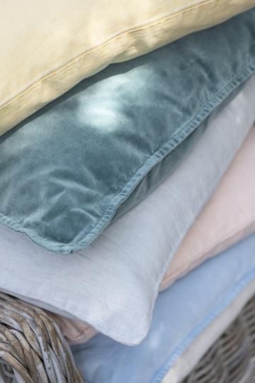 IB Laursen Nordic Sky velvet cushion with soft blue fabric and decorative stitching, perfect for summer home decor.