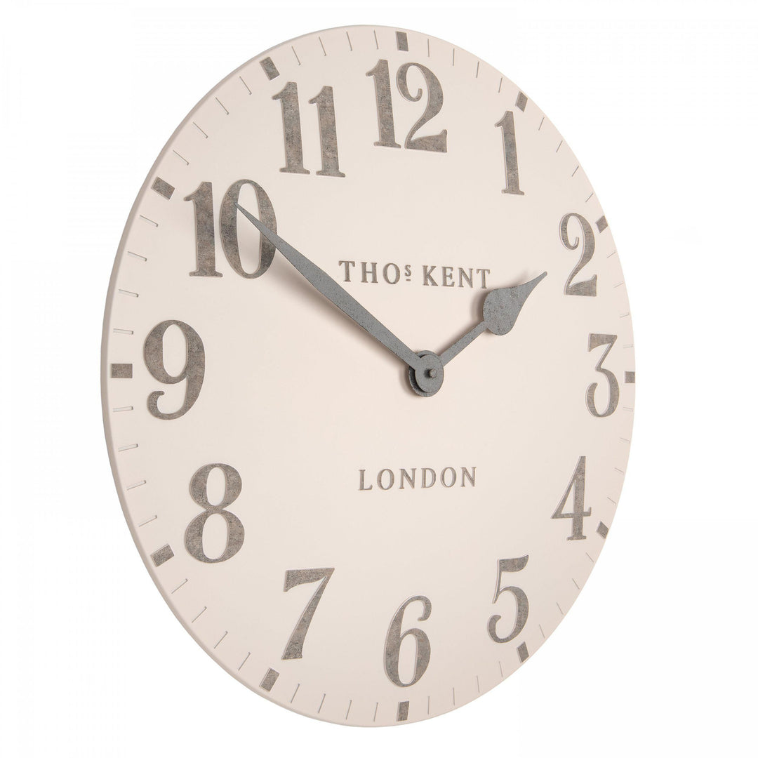 20-foot Arabic wall clock in shy pink, modern art design by Cornucopia Home and Gift, featuring bold white Arabic numerals and sleek style.