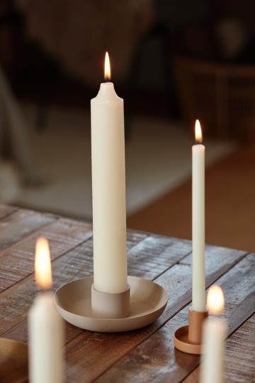 White rustic candle from IB Laursen Summer collection, displayed on a wooden surface with a cozy, farmhouse style.