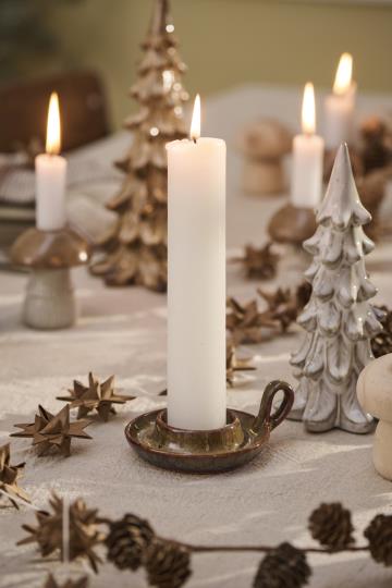 White rustic candle from IB Laursen Summer collection, displayed on a wooden surface with a simple, cozy design.