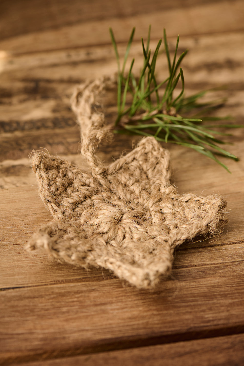Crocheted jute hanging star ornament for Christmas by IB Laursen, featuring rustic crochet details and natural jute material.