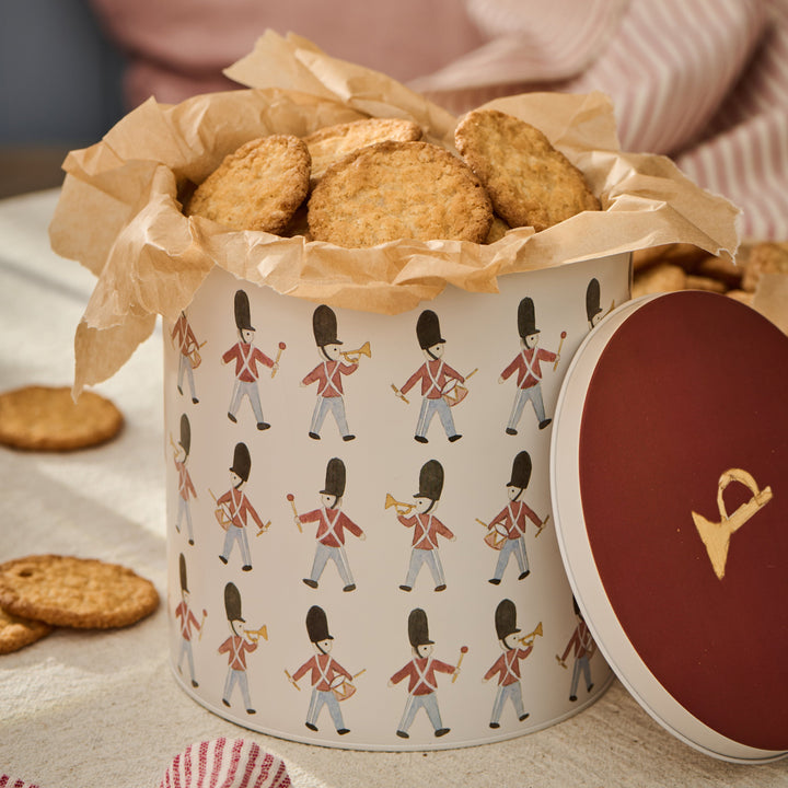 Round IB Laursen Christmas cake tin with protective guards, ideal for baking and storing festive cakes.