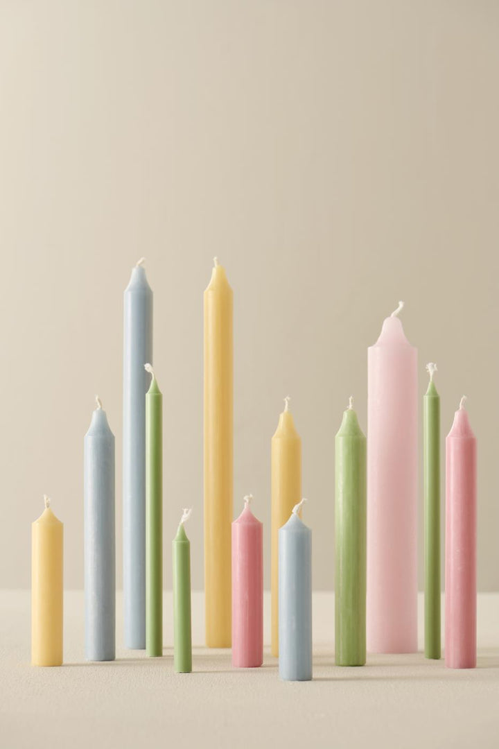 Light pink rustic candle from IB Laursen Summer collection, displayed in a cozy home setting.