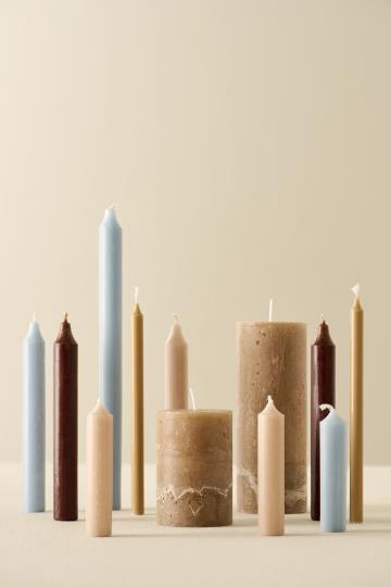 Rustic sand-colored IB Laursen short dinner candle with a simple, elegant design for table decor.