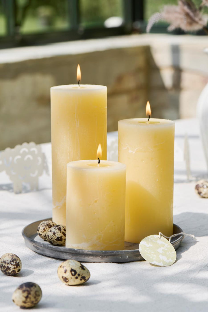 IB Laursen rustic pillar candle in vibrant lemonade yellow, perfect for summer decor, by Cornucopia Home and Gift.