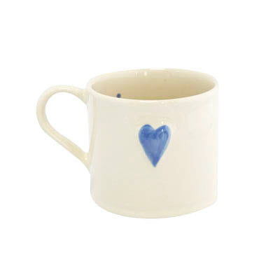 Pale blue ceramic heart-shaped mug by Cornucopia Home and Gift, perfect for tea or coffee, featuring a charming heart design.