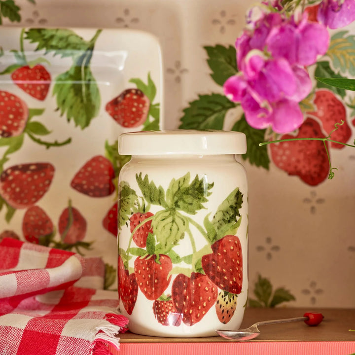 Emma Bridgewater Strawberries medium jam jar with lid, featuring a colorful strawberry design and ceramic lid.