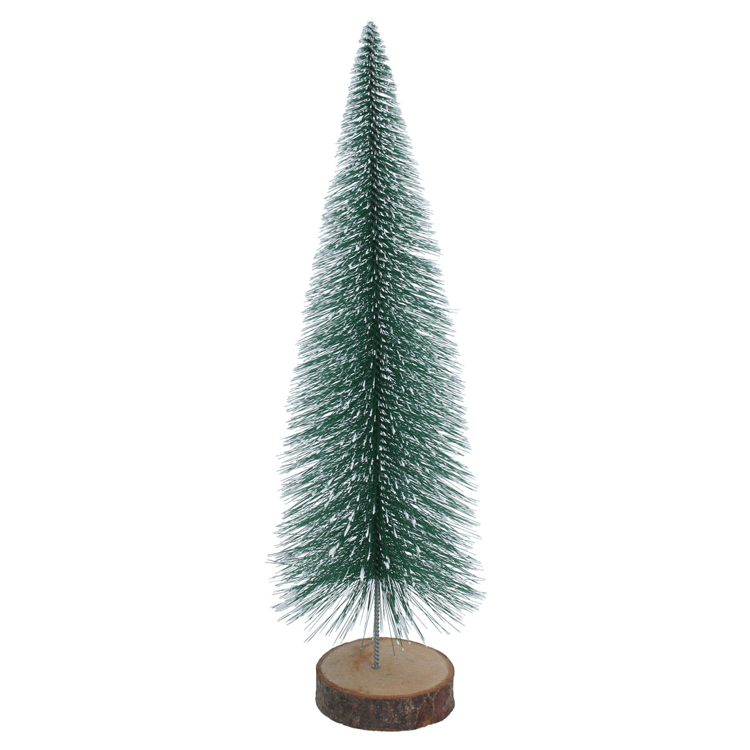 Gisela Graham Christmas snowy green bristle effect tree on a log display, perfect for holiday decor from Cornucopia Home and Gift.