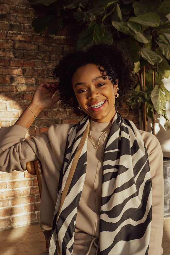 Tutti & Co Adorn Scarf featuring floral pattern in soft pastel colors, made of lightweight fabric for stylish wear.
