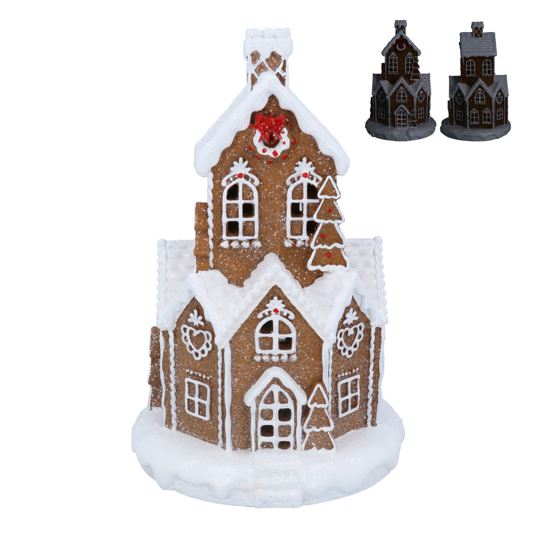 White iced light-up gingerbread village by Gisela Graham for Christmas, featuring festive holiday decorations and illuminated gingerbread houses.