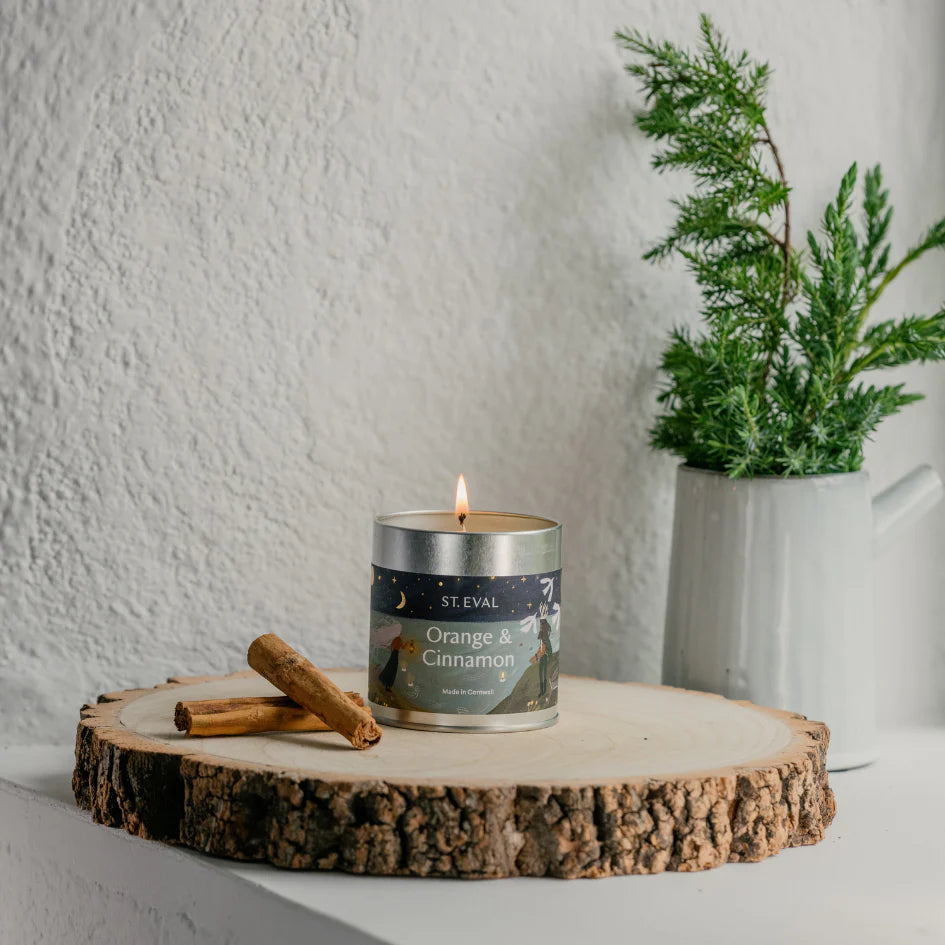 St Eval Christmas orange and cinnamon tin candle with festive orange and cinnamon scent, in a decorative metal tin.