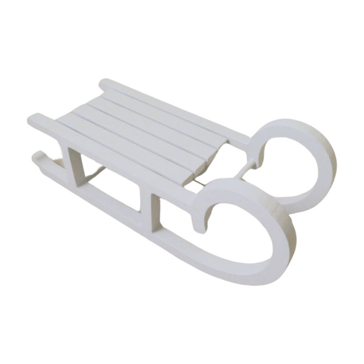 Large white wooden sleigh from Cornucopia Home and Gift, Christmas giftware trading decor, with detailed wooden construction.