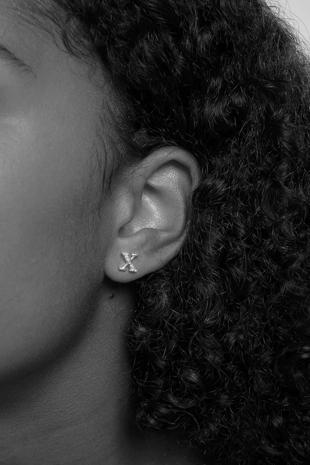 Silver Kingston Earrings by Tutti &amp; Co featuring a sleek, modern design, displayed on a neutral background.