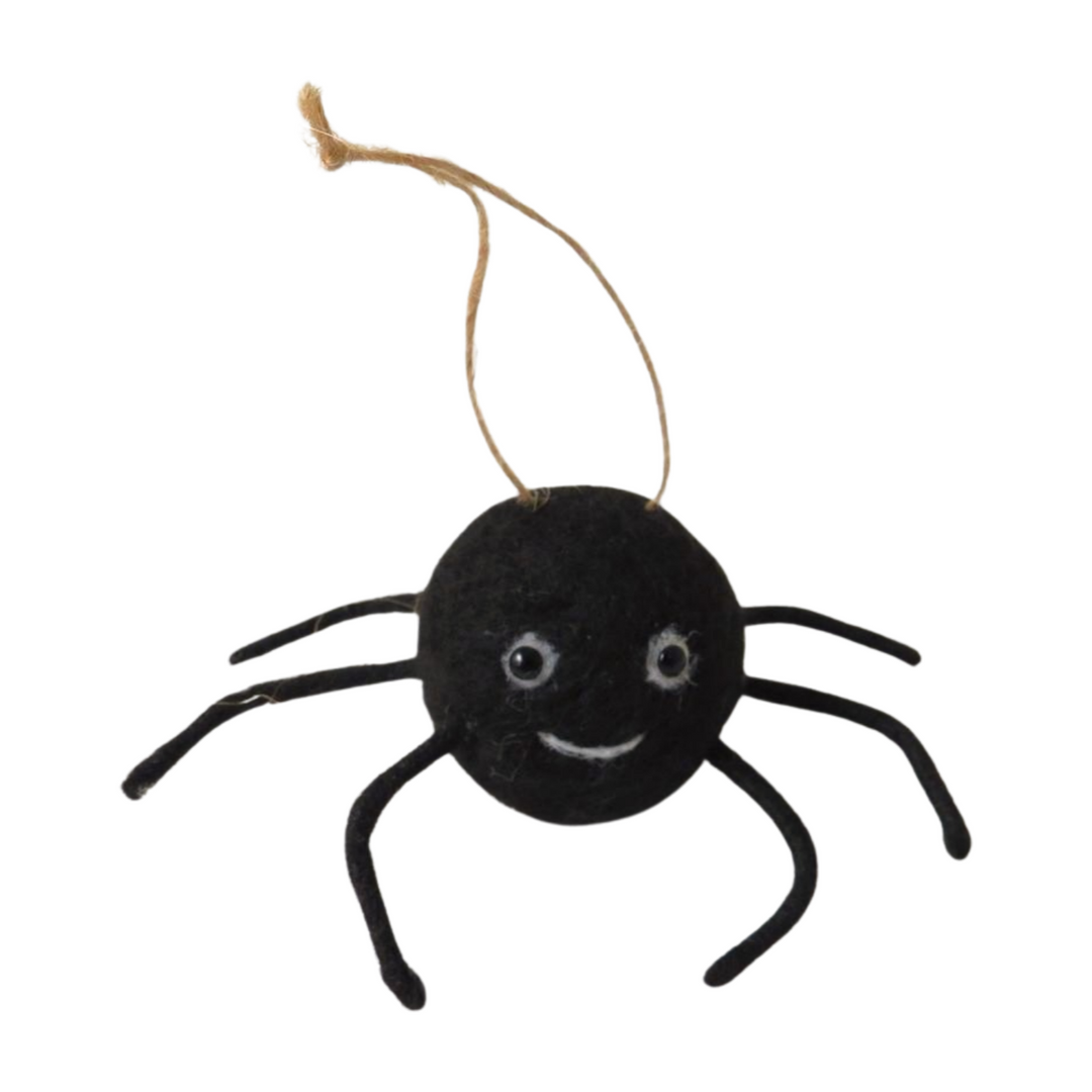 Spider hanging tree decoration by Cornucopia Home and Gift, featuring a detailed black spider ornament on a tree branch.