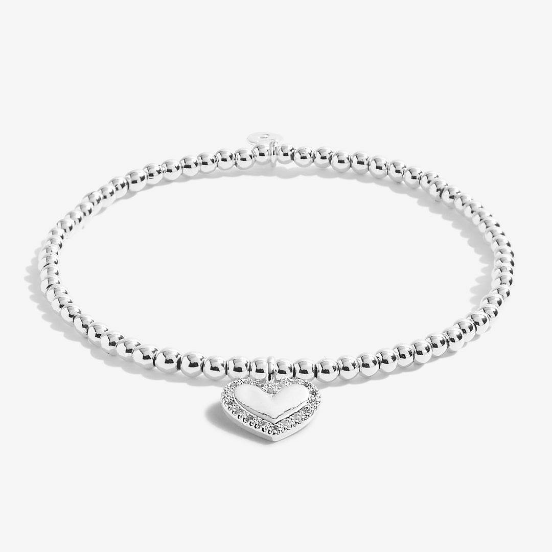 Joma Jewellery A Little Super 60 bracelet with silver-tone charm and delicate chain on a neutral background.