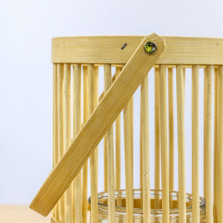 Natural bamboo rattan lantern from Cornucopia Home and Gift, showcasing a handcrafted, woven design ideal for home decor.