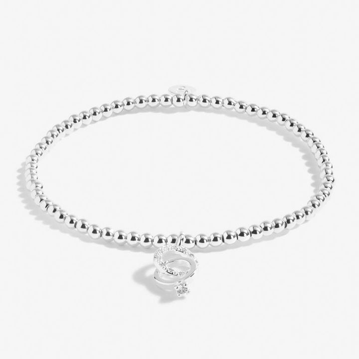 A Little Miss to Mrs bracelet by Joma Jewellery featuring a delicate silver chain and charm with elegant script design.