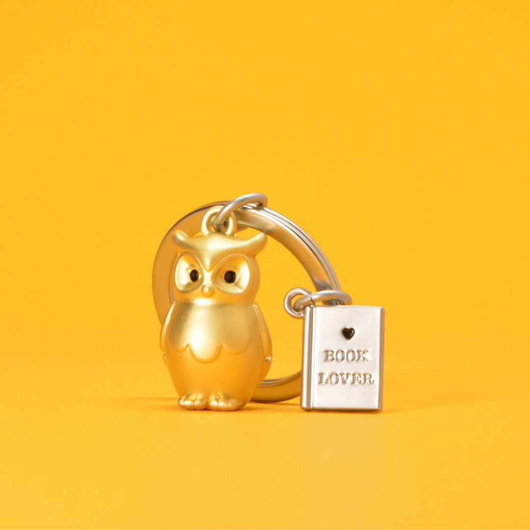 Gold Owl and Book keyring by Oli Olsen featuring a detailed owl and open book charm, ideal for keys or bags.