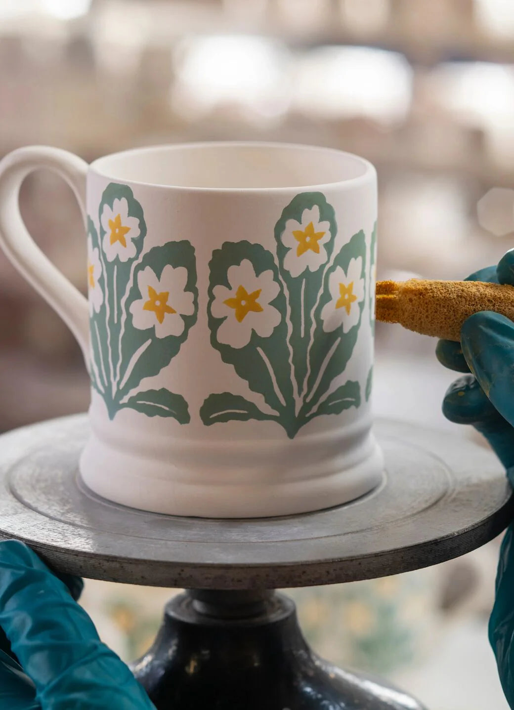Emma Bridgewater Flowers Primrose ½ pint mug with colorful floral design and smooth ceramic finish.