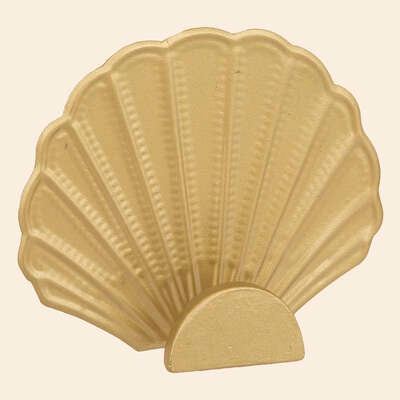 Cornucopia Home and Gift Shell Hooks mounted on a wall, decorative nautical-inspired hooks for hanging items.