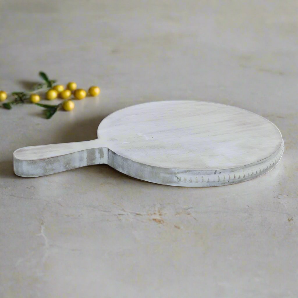 Large beaded mango wood chopping board by Cornucopia Home and Gift, featuring a decorative beaded edge and smooth cutting surface.