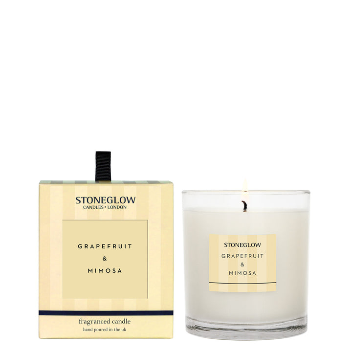 Stoneglow Modern Classics grapefruit and mimosa boxed tumbler candle with a clear glass container and decorative label.