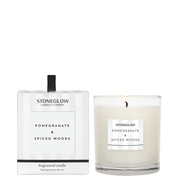 Stoneglow Modern Classics Pomegranate and Spiced Woods boxed tumbler candle with a decorative label and warm-toned packaging.
